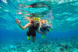 A woman enjoying diving with her daughter