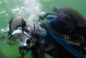 A diver breathing underwater