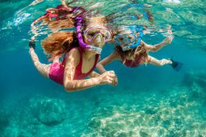 Children diving with dry snorkels